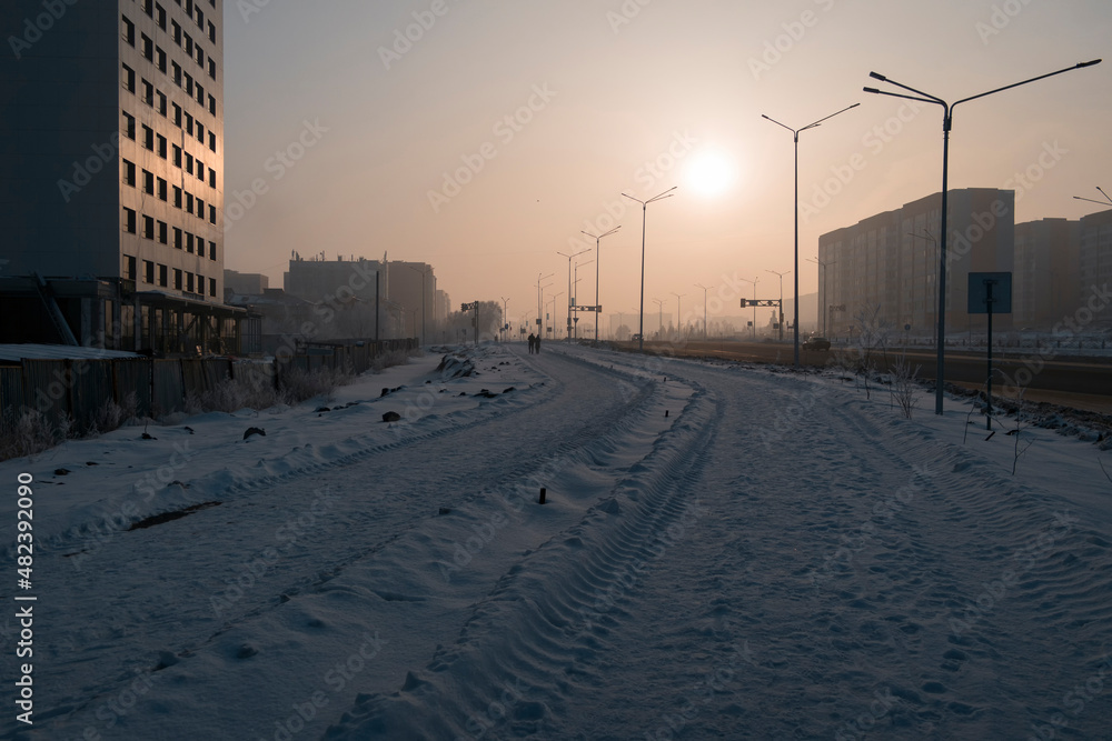Newly built large avenue. New residential area. Construction site. Buildings under construction. Harsh winter. Ust-Kamenogorsk (kazakhstan)
