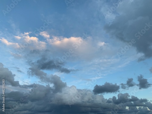 Blue sky with fluffy evening clouds © Oksana