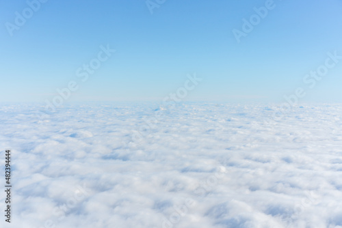 Background with the clouds view of the airplane window © MontenegroStock