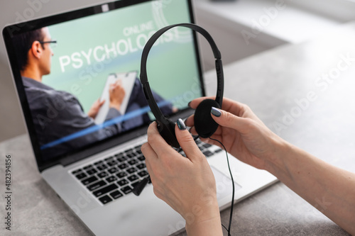 Psychological consultation online - man lists his problems - communicates with the patient using the digital technology - remote psychodiagnosis session photo