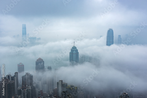 Photography Skyscraper in downtown of Hong Kong city in fog