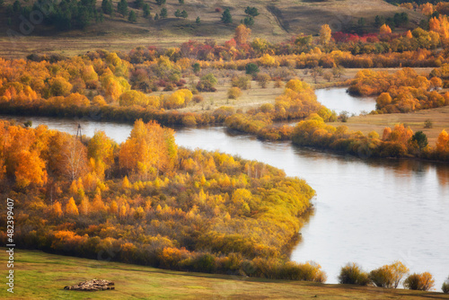 Cloudy autumn landscape with river