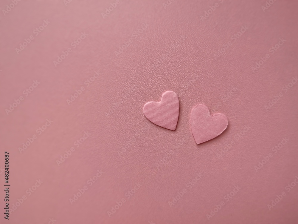 Fototapeta premium Valentine's Day background. Pink hearts on pink background. copy space. Valentines day concept.