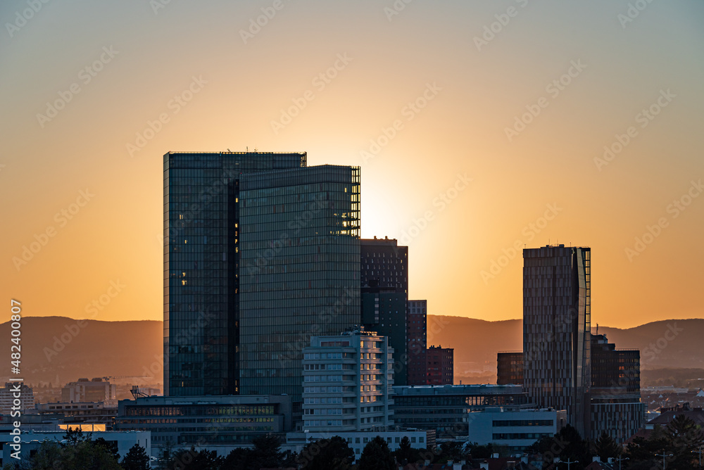 Sunset over Vienna Woods with office buildings 