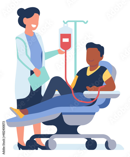 Nurse taking blood from donor. Man sitting in medical chair