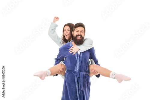 Happy girl ride piggyback on man screaming hurrah in morning isolated on white, enjoy photo