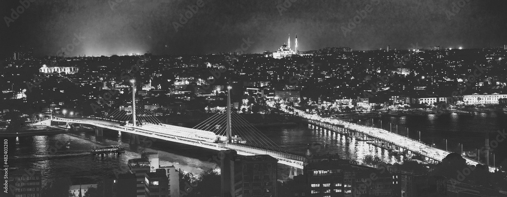Night aerial view of Istanbul cityscape and bridges over the city river, Turkey.