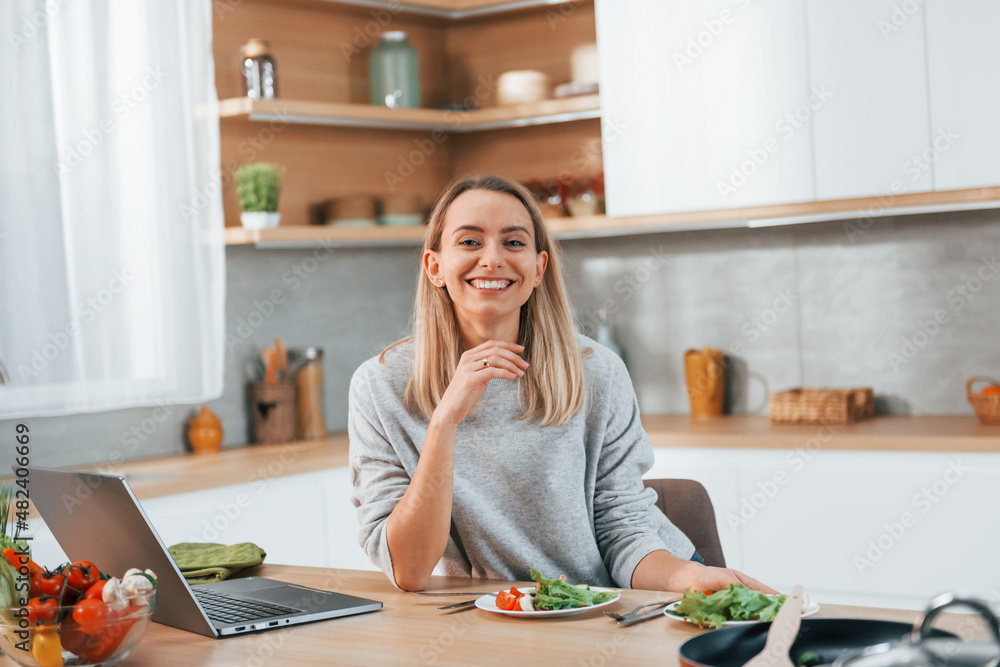 Woman preparing food at home on the modern kitchen Woman preparing food at home on the modern kitchen