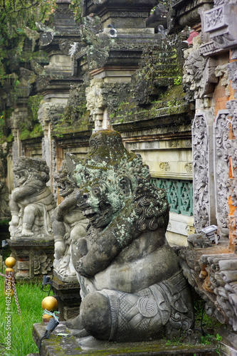 Stone statues with Balinese ornaments become decorations in front of Ubud Palace, Bali
