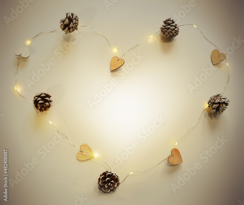 A garland of wooden hearts, cones in the shape of a heart.