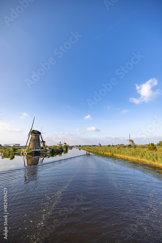 Vertical picture of one of the famous Dutch windmills at Kinderdijk, a UNESCO world heritage site. On the photo is one mill of the 19 windmills at Kinderdijk, South Holland, the Netherlands, which are