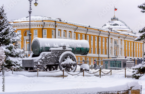 Tsar cannon on the background of Senate Palace is official residence of the President of the Russian Federation in Moscow Kremlin, Moscow, Russia. Winter scene of Moscow Kremlin.