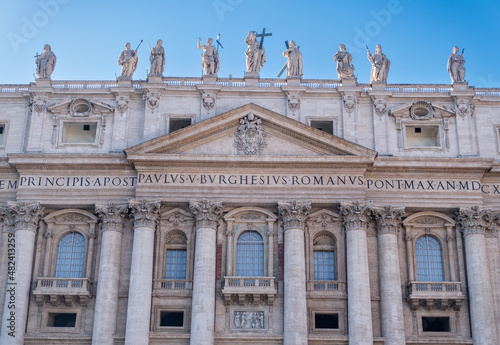 Low angle view of exterior and entrance of Saint Peter's Basilica.