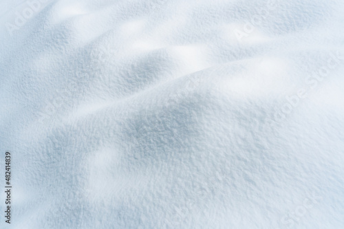 Snow texture background. Winter texture, fresh snow background with dunes. 