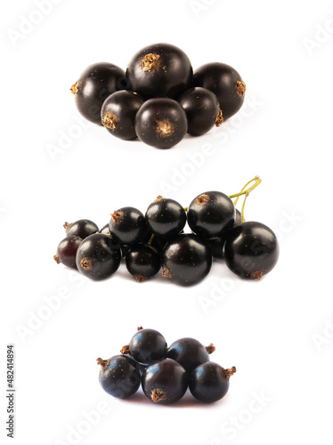 Bunch of blackcurrant isolated on white background. Blackcurrant isolate. Blackcurrants heap isolated on white background.