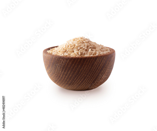 Bowl with brown rice isolated on white background. Close-up. Grain rice on white background.