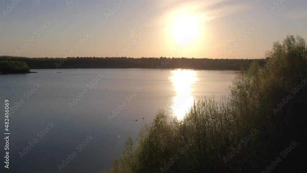 Beautiful View of Scenic lake with water reflection, surrounded by Forest and trees at Sunset. Aerial Drone Shot. Taken near Beerse, Belgium. 4K. High quality 4k footage Beautiful View of Scenic lake with water reflection, surrounded by Forest and trees at Sunset. Aerial Drone Shot. Taken near Beerse, Belgium. 4K. High quality 4k footage