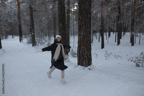 A young girl runs and rejoices in the winter. © Ekaterina Ershova