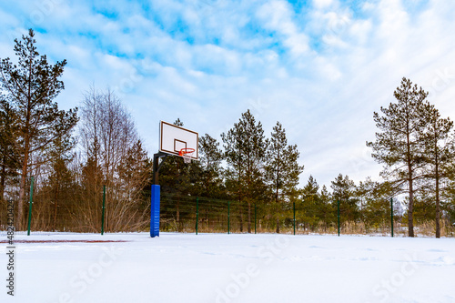 Basketball field covered with snow