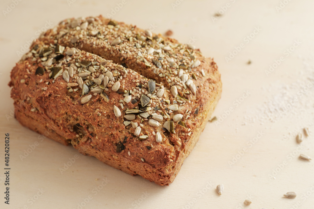 Healthy whole grain bread with seeds and kernels, homemade baking with protein and fiber for a low carb diet, copy space, selected focus Healthy whole grain bread with seeds and kernels, homemade baking with protein and fiber for a low carb diet, copy space, selected focus