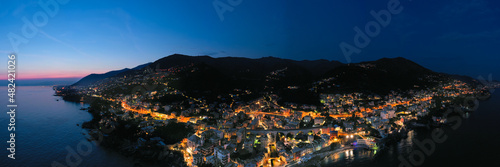 View of the city of Bogliasco from the air. Night light. Italy.