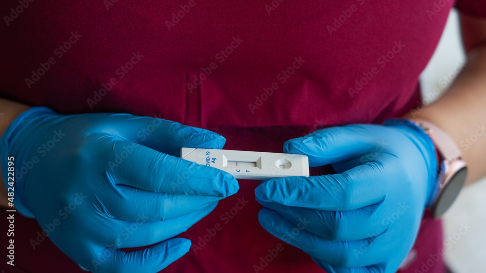Covid 19 antigen test hold in hands Covid 19 antigen test hold in hands