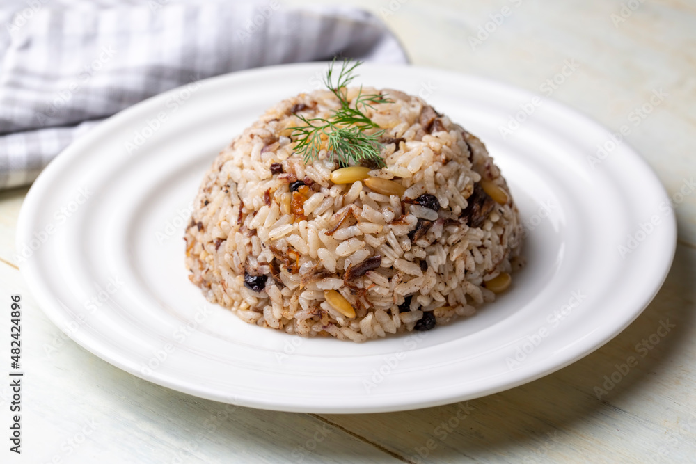 Traditional delicious Turkish food; rice pilaf with pine nuts and currants (Turkish name; ic pilav or pilaf) Traditional delicious Turkish food; rice pilaf with pine nuts and currants (Turkish name; ic pilav or pilaf)