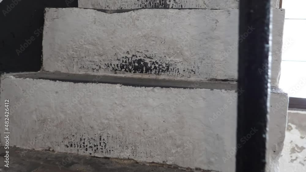 Personal perspective climbing up white concrete stairs indoors, close up view. Personal perspective climbing up white concrete stairs indoors, close up view.