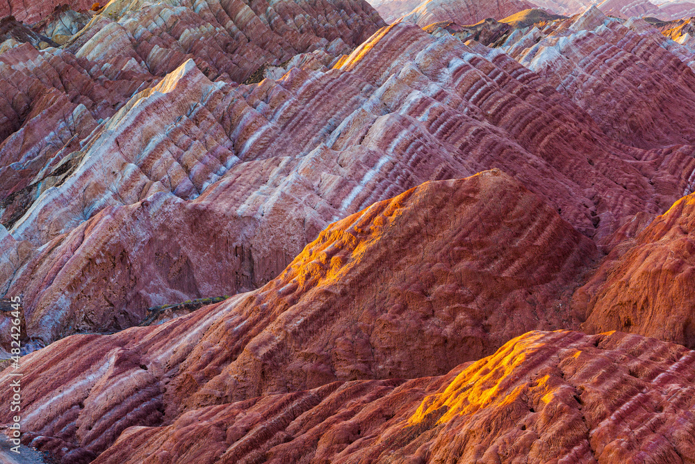 Sunrise over the colorful eroded badlands in the Zhangye Danxia National Geopark, Gansu Province, China
