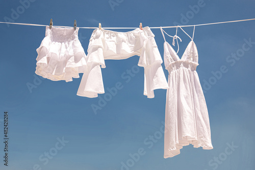 White clothes line in blue sky in through sunny day