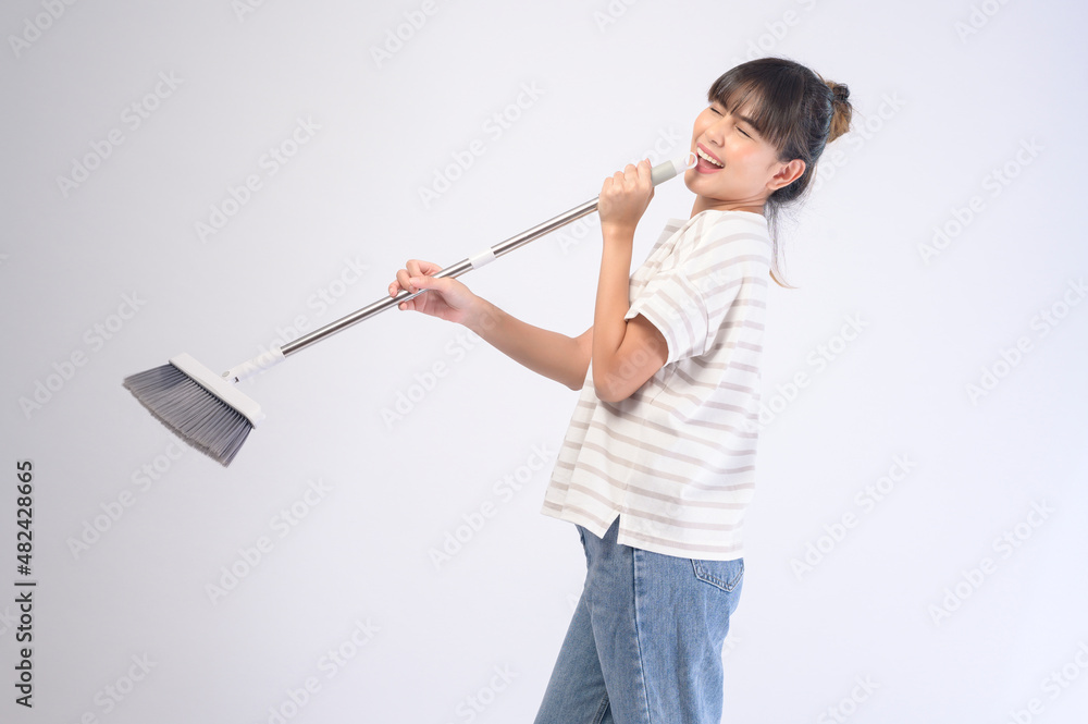 Young beautiful housewife smiling on white background Young beautiful housewife smiling on white background