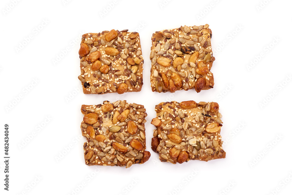 Cookies with nuts and seeds of peanut, sunflower seeds, sesame, linen, organic food, isolated on white background. Cookies with nuts and seeds of peanut, sunflower seeds, sesame, linen, organic food, isolated on white background.