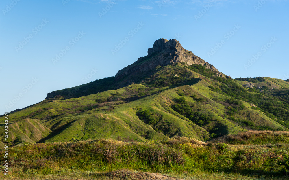Green rock mountain Karadag at sunset near Koktebel, Crimea. spring landscape