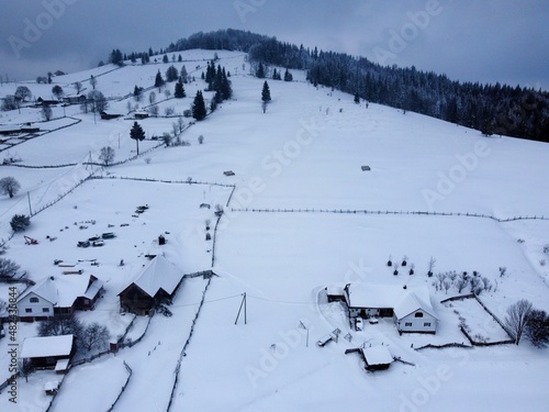 Hill and cabins in the winter time © Claudiu