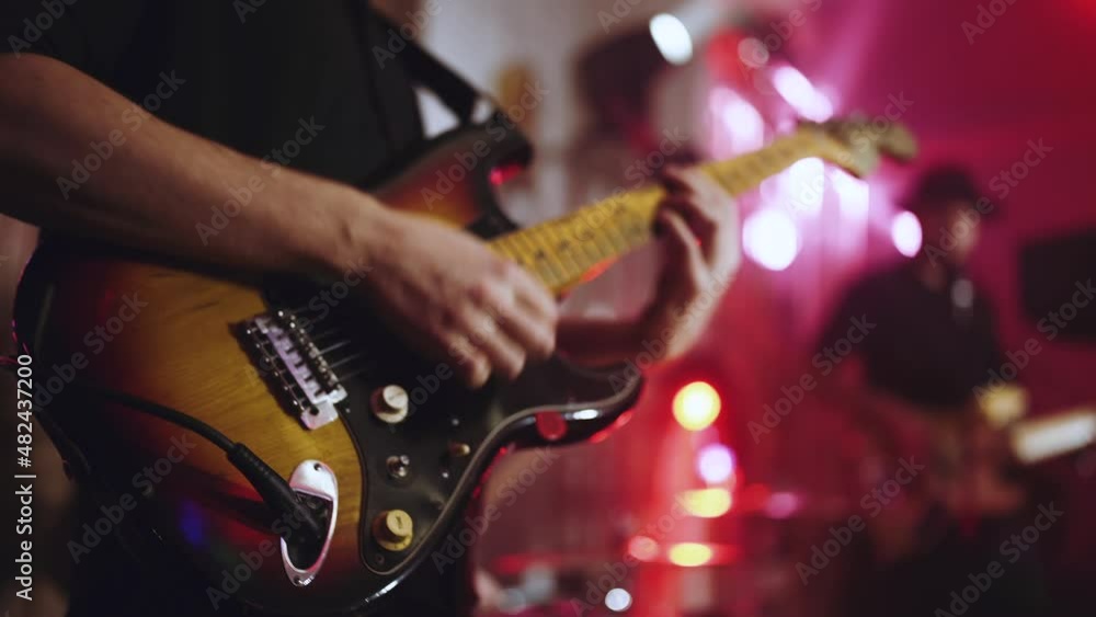 Close-up of an electric guitar during a guitarist's performance