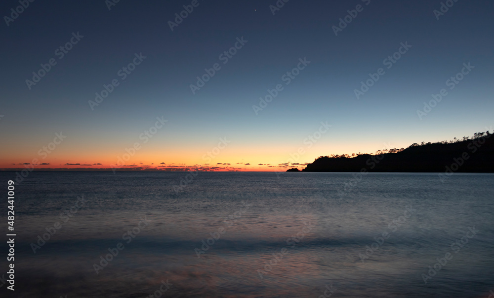 Beautiful red, orange sunset. Sand, sea and mountain view. Horizontal web banner. Copy paste and text space. Beautiful red, orange sunset. Sand, sea and mountain view. Horizontal web banner. Copy paste and text space.