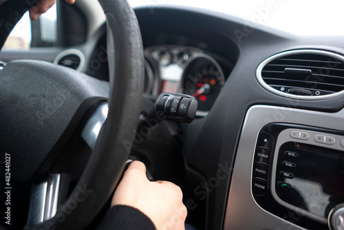 driver with car keys starting the vehicle ignition