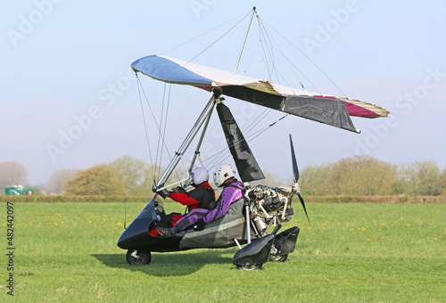 Ultralight airplane taxiing on a farm strip	
