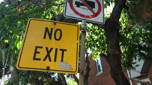 NO EXIT and trucks forbidden sign on residential street. Toronto, Canada.