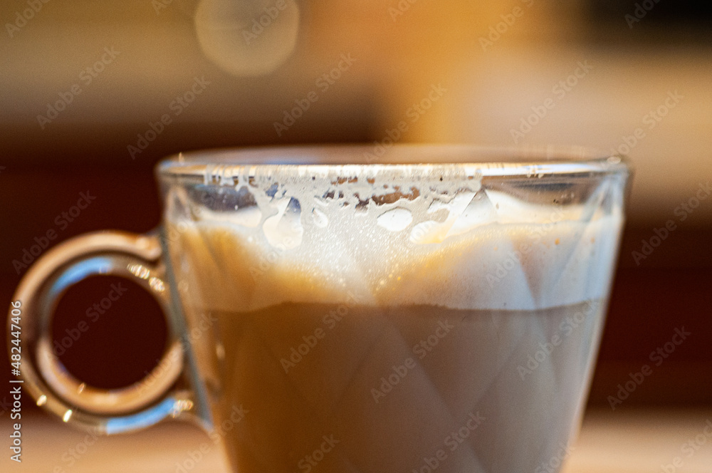 started glass of cappuccino started glass of cappuccino