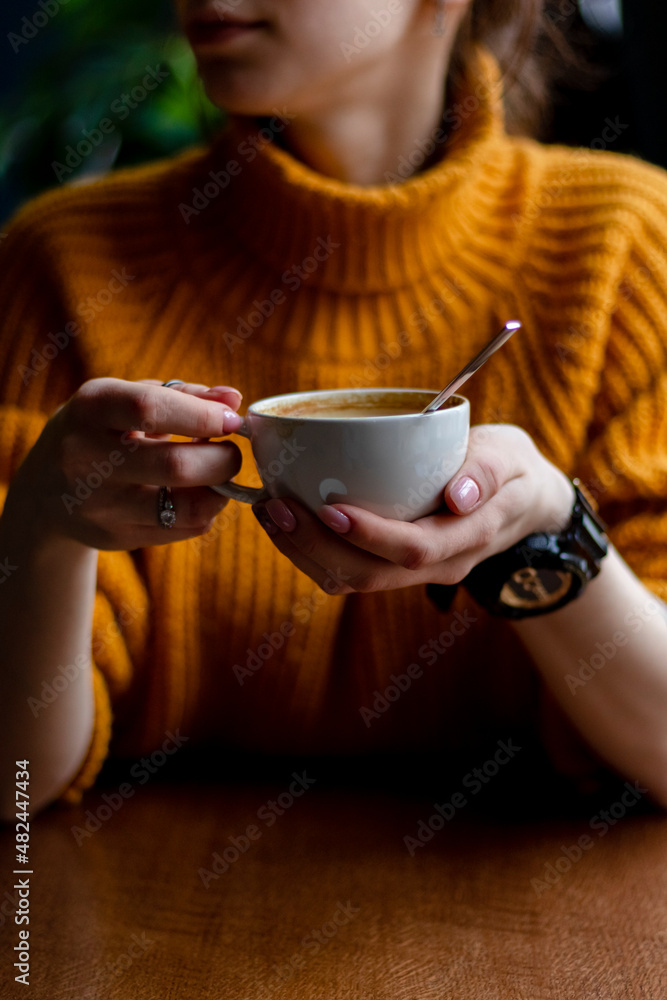 Woman in a cafe drinking coffee Woman in a cafe drinking coffee