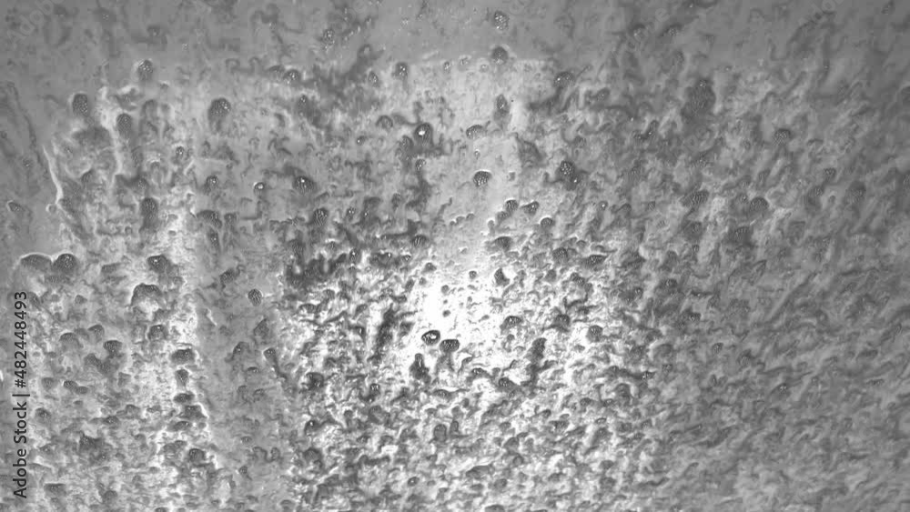 Bubbles in liquid rising slowly from bottom to top, in an abstract concept clip. Bubbles in liquid rising slowly from bottom to top, in an abstract concept clip.