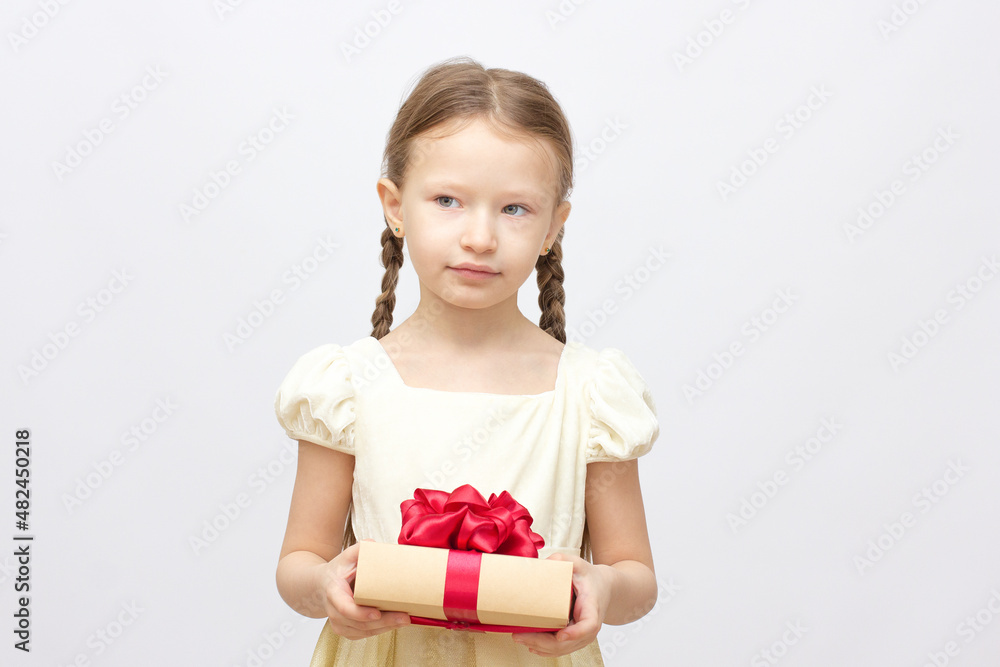 Adorable little surprise girl with gift box present on background Adorable little surprise girl with gift box present on background