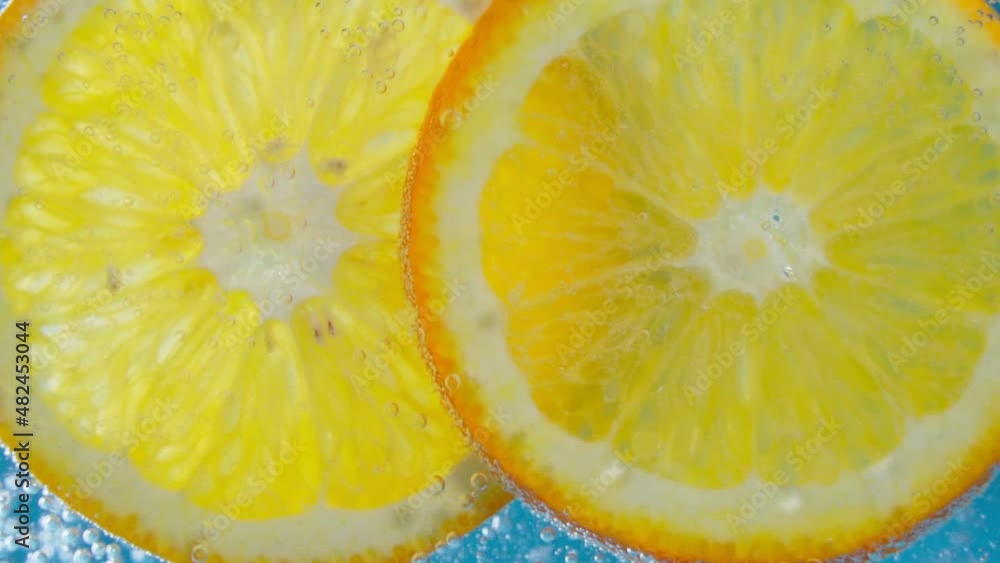 Orange Slices under water vegan and vegetarian concept. Slow motion Orange Slices under water vegan and vegetarian concept. Slow motion