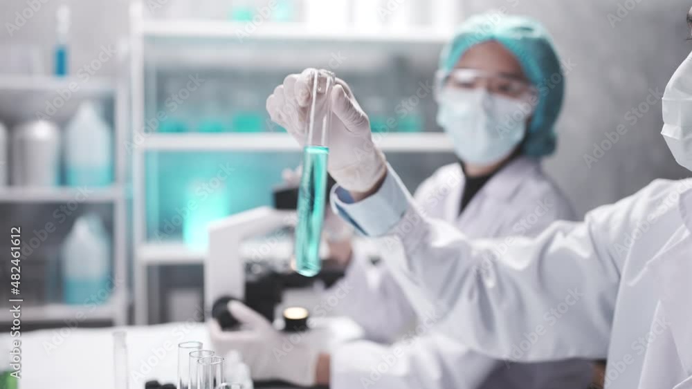 medical scientist team are working on science laboratory research term by using microscope and scientific equipment in experiment of medicine technology, pharmaceutical analysis education