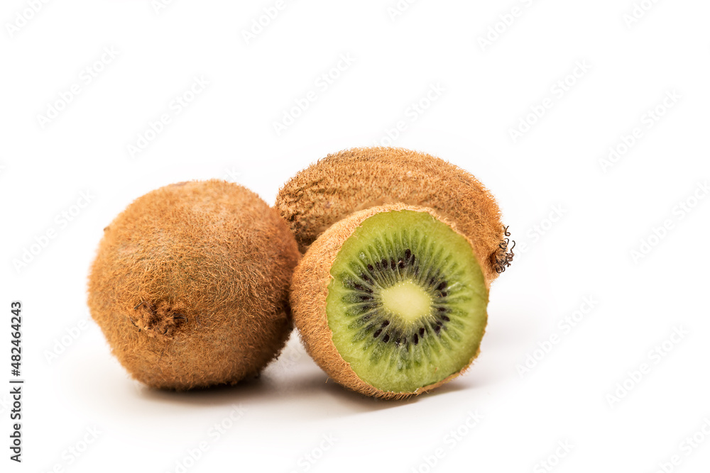 Obraz premium Kiwi Fruits Isolated on White Background, Whole kiwi fruit and half kiwi fruit isolated with clipping path included