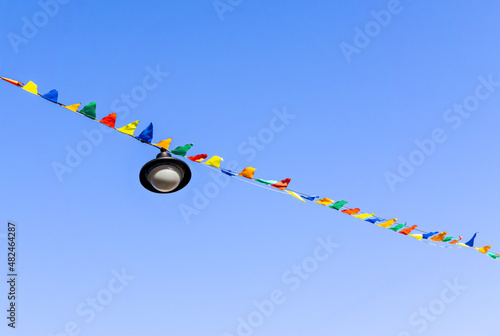 Garland of flags against sky