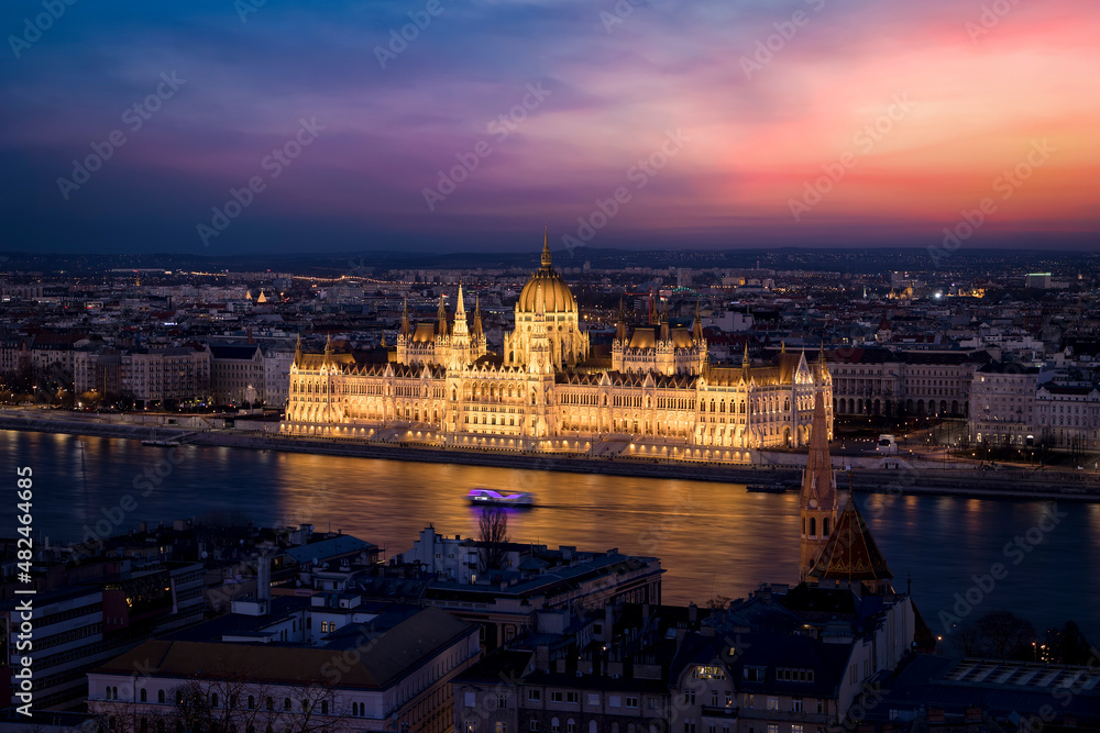 Elevated view of the illuminated Hungarian Parliament Building at the river Danube in Budapest during a colorful evening