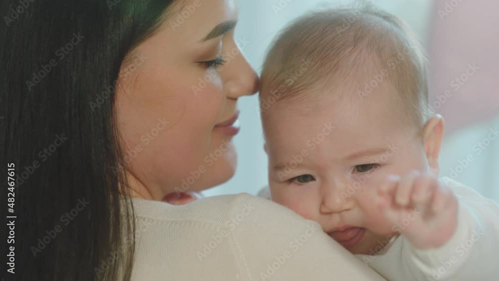 Portrait of a beautiful baby and his mother hugging lovely each other and feeling in love concept of maternity and childhood Portrait of a beautiful baby and his mother hugging lovely each other and feeling in love concept of maternity and childhood