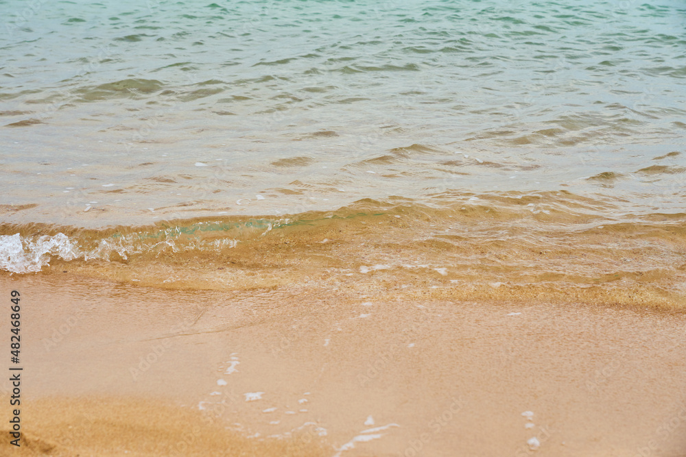 Waves on the tropical sandy beach of the red sea.